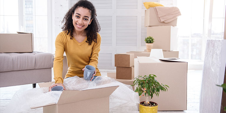 Woman Packing Delicate Fragile Items