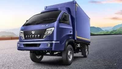 Eicher mini truck being loaded with large office furniture and oversized household items for a commercial move