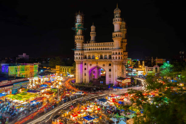 Family standing at a viewpoint overlooking HITEC City's glass office towers in Hyderabad