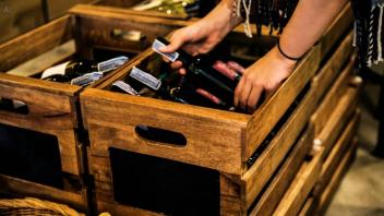 Wine bottle being packed in crate