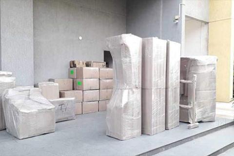 M Shine World Cargo Packers Movers Unloading
